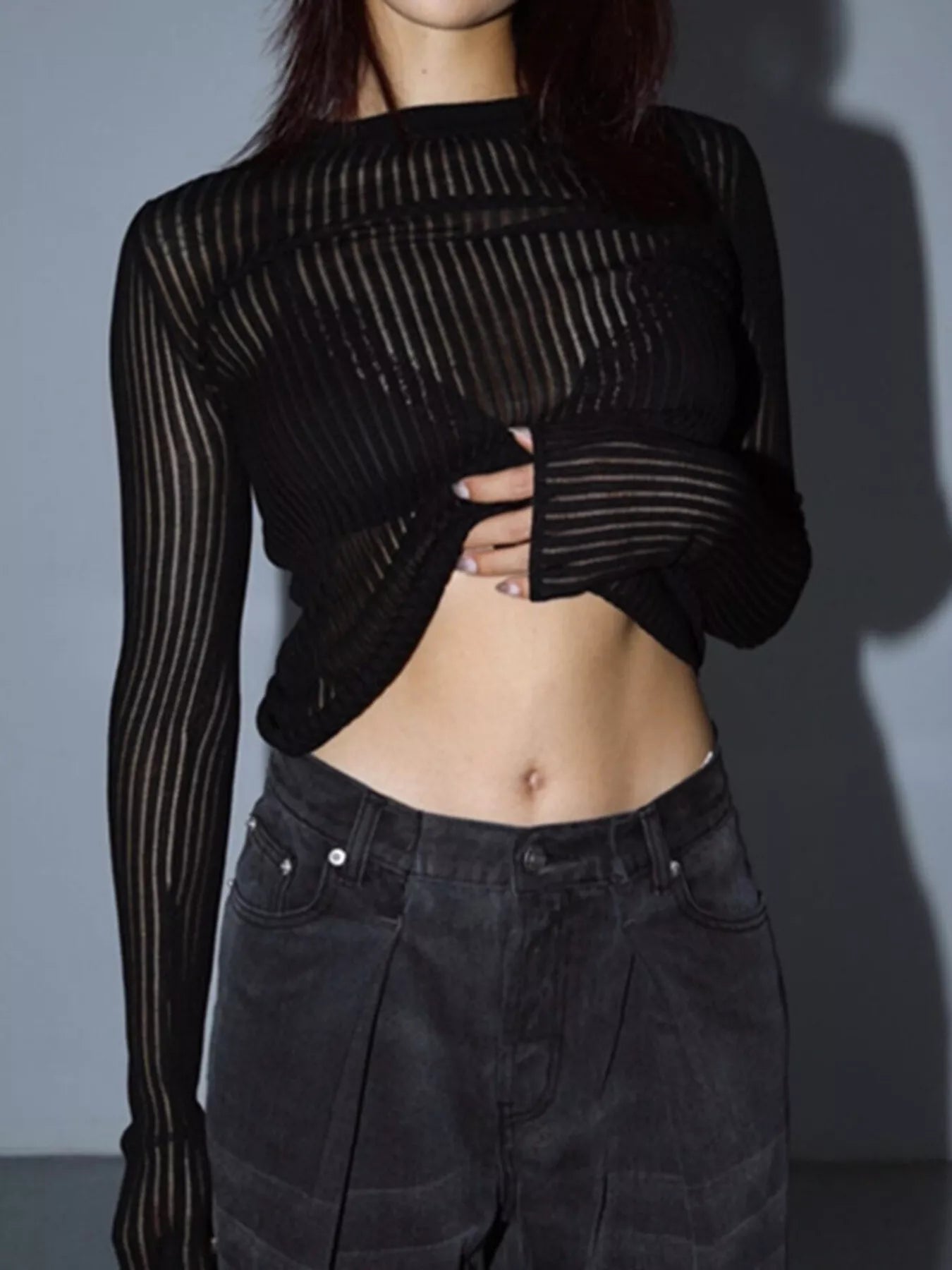 Ribbed Knit Long Sleeve Top for everyday wear, sheer black top paired with stylish dark pants, perfect for casual outings.