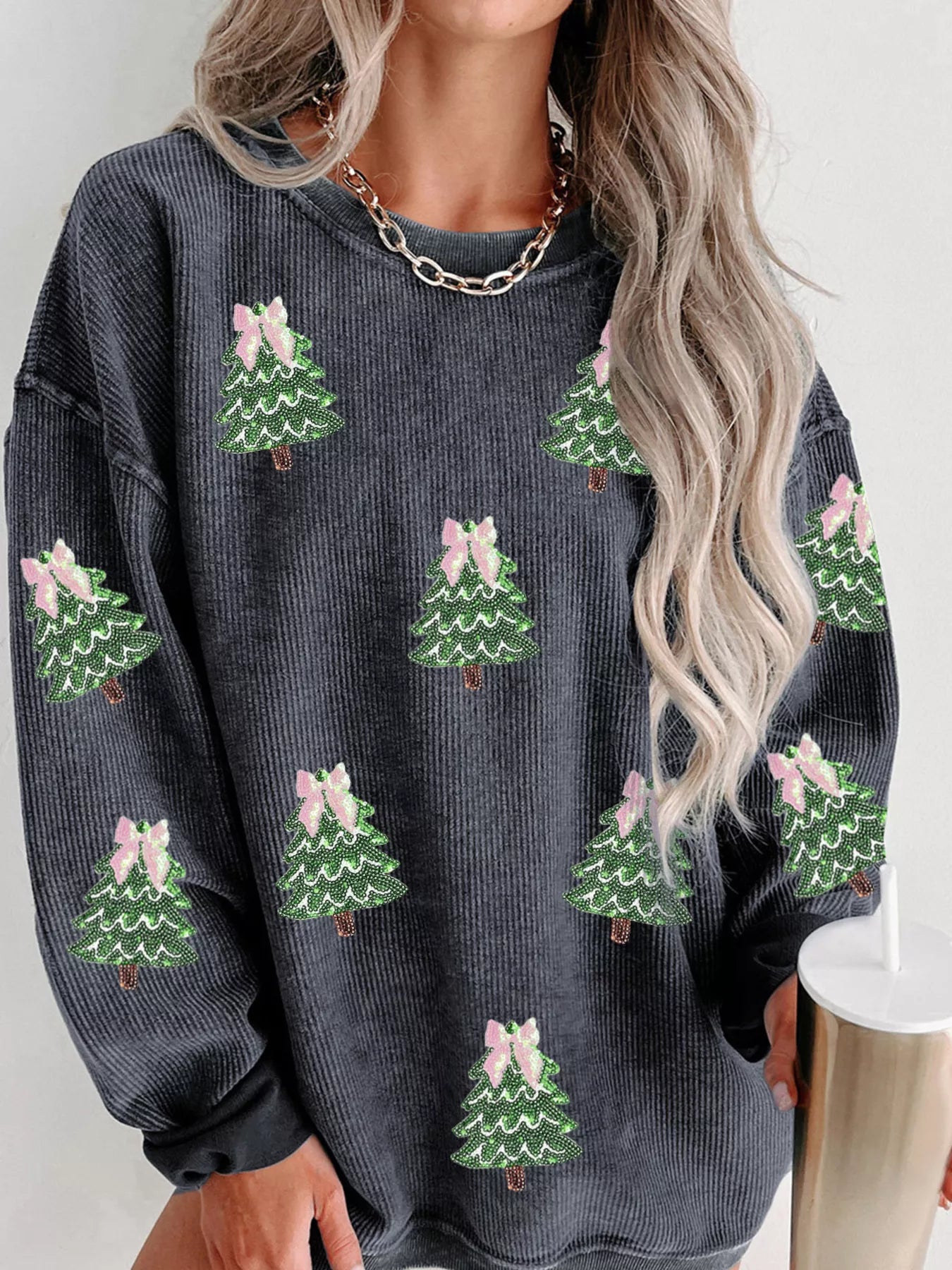 Ribbed Round Neck Sequin Christmas Sweatshirt featuring festive Christmas tree and bow designs.