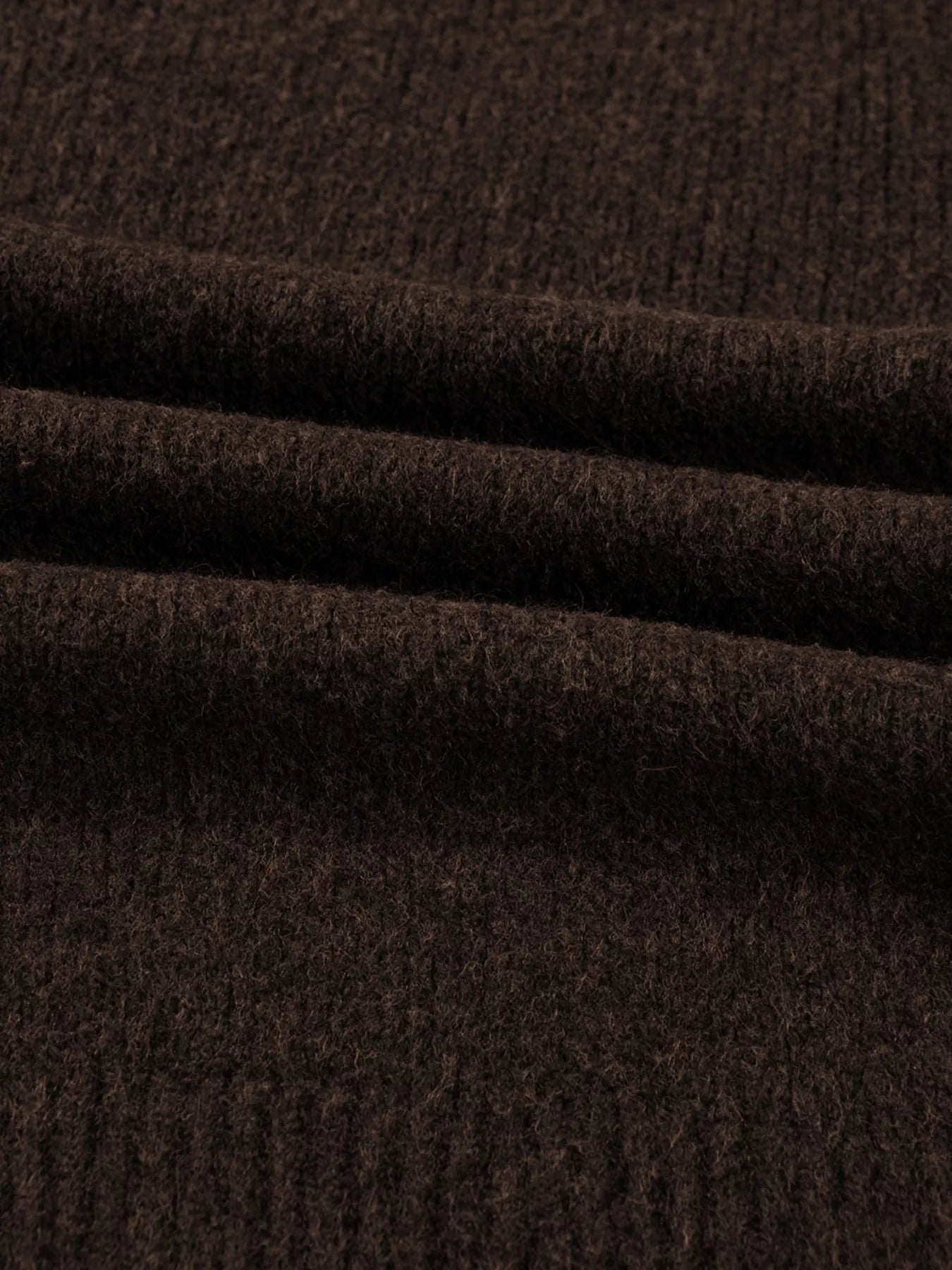 Close-up of dark brown fabric showcasing texture of Heart Metal Button V Neck Cardigan Sweater for Women.