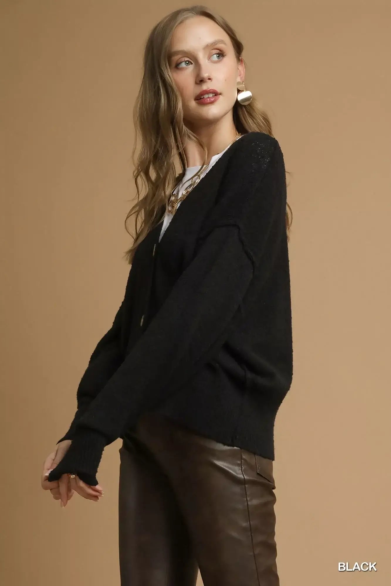 Umgee Button-Front V-Neck Knit Cardigan for Women in black color worn with stylish accessories.
