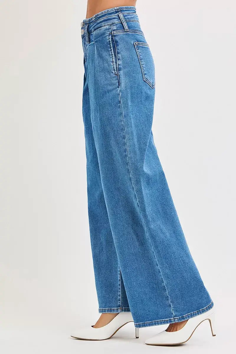 Side view of RISEN Pleated Wide Leg Jeans Plus Size in mid rise fit, showcasing elegant pleats and wide leg design.