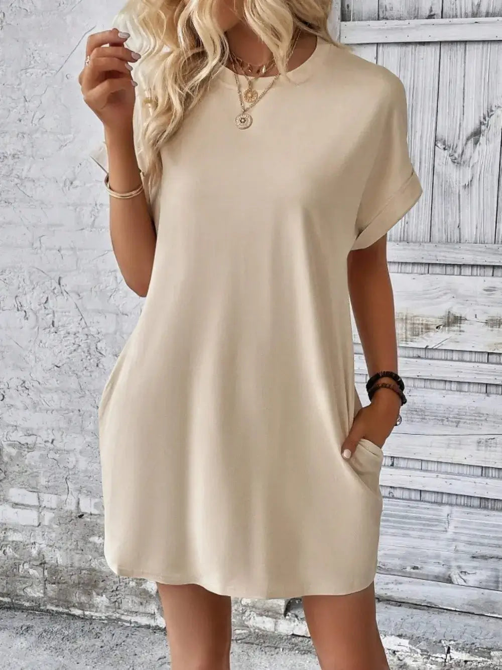 Beige pocketed round neck short sleeve dress, featuring a relaxed fit and casual style, perfect for everyday wear.