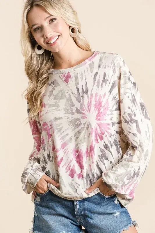 BiBi Tie Dye Print Terry Pullover worn by a smiling woman, featuring a colorful tie-dye design and relaxed fit.