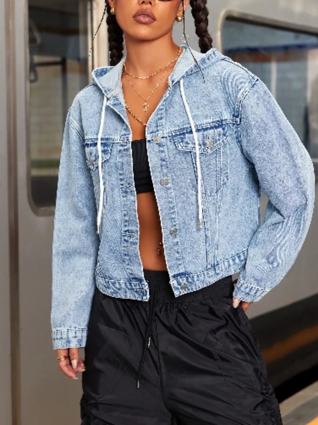 Hooded Drawstring Cropped Denim Jacket for Women styled with black pants in an urban setting.
