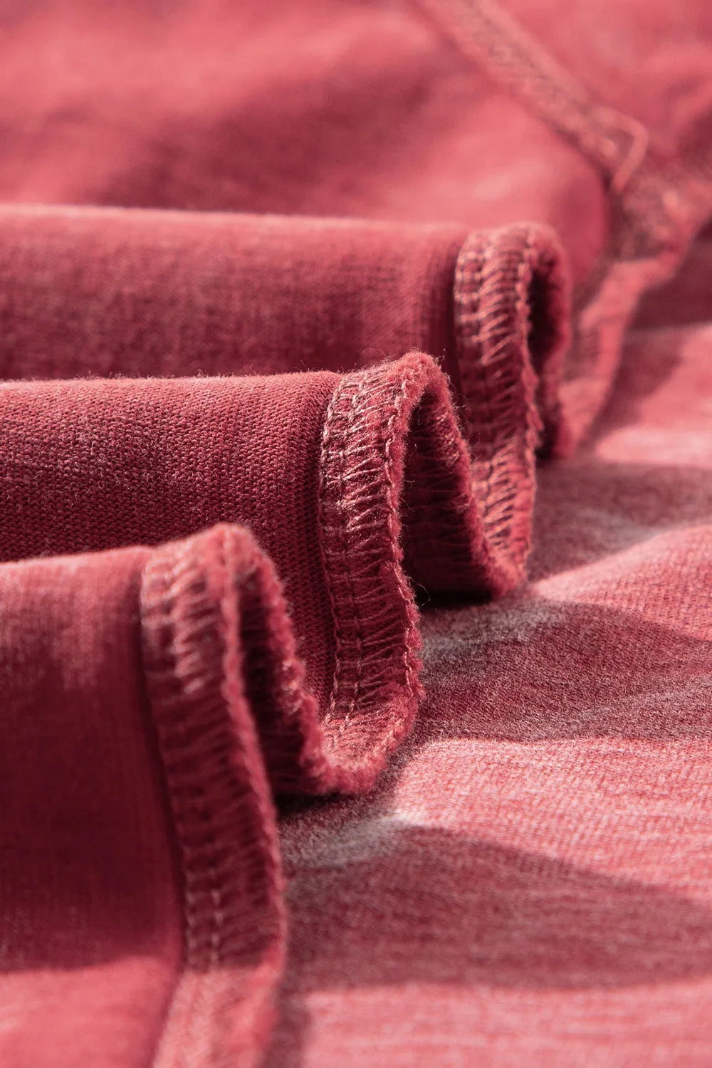 Detail of fabric folds showing texture of the One Shoulder Half Sleeve Oversized Tunic T Shirt for Women.