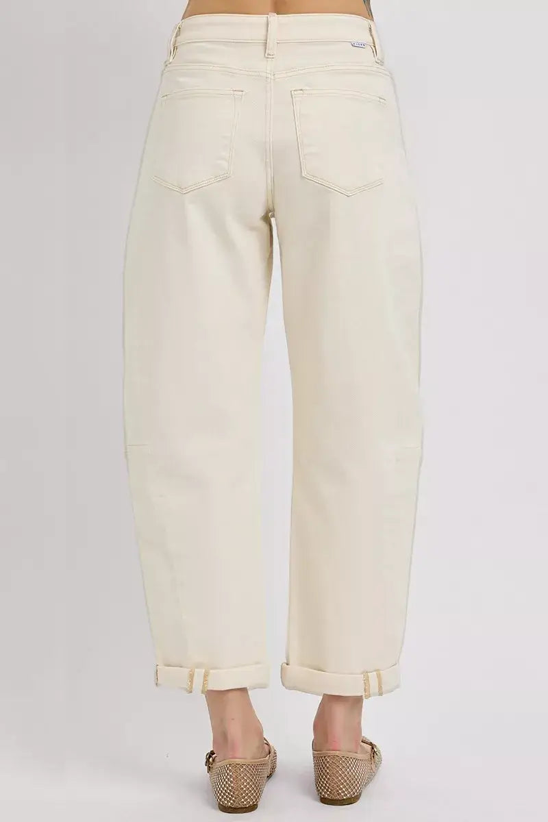Back view of RISEN high rise relaxed barrel cuffed jeans in cream color, showcasing cuffed hems and premium denim.
