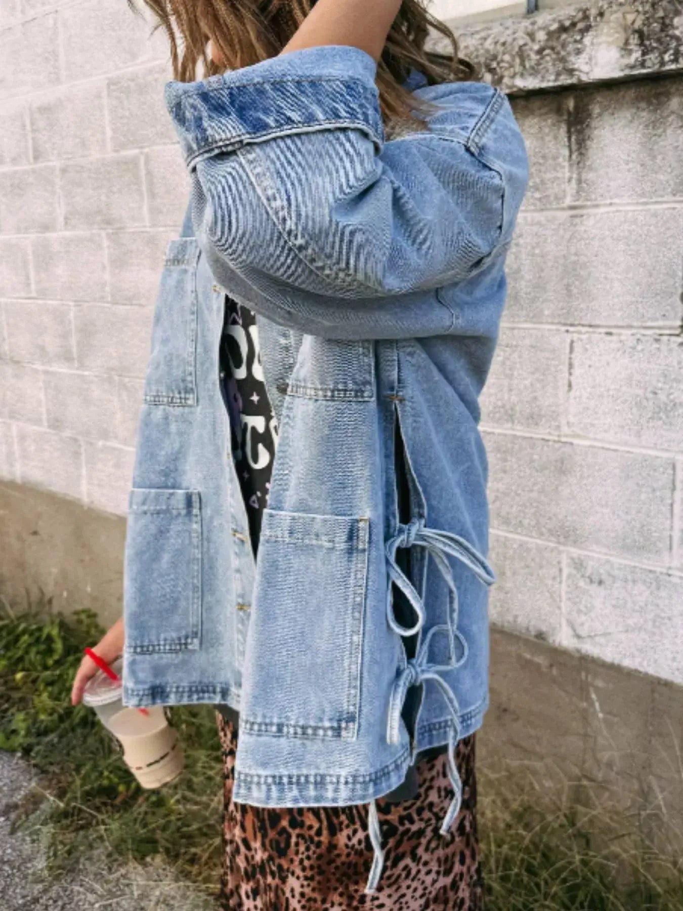 Stylish side view of a women’s patched pockets side tie denim jacket, perfect for a trendy look with added pockets.
