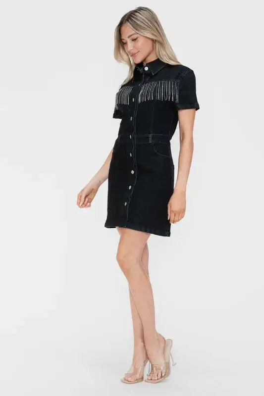 Model wearing Bytos Full Size Embellished Button Down Short Sleeve Denim Dress with fringe details.