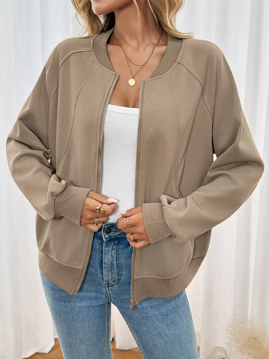 Zip Up Raglan Sleeve Jacket on a woman, showcasing a comfortable fit with a stylish design in a neutral color.