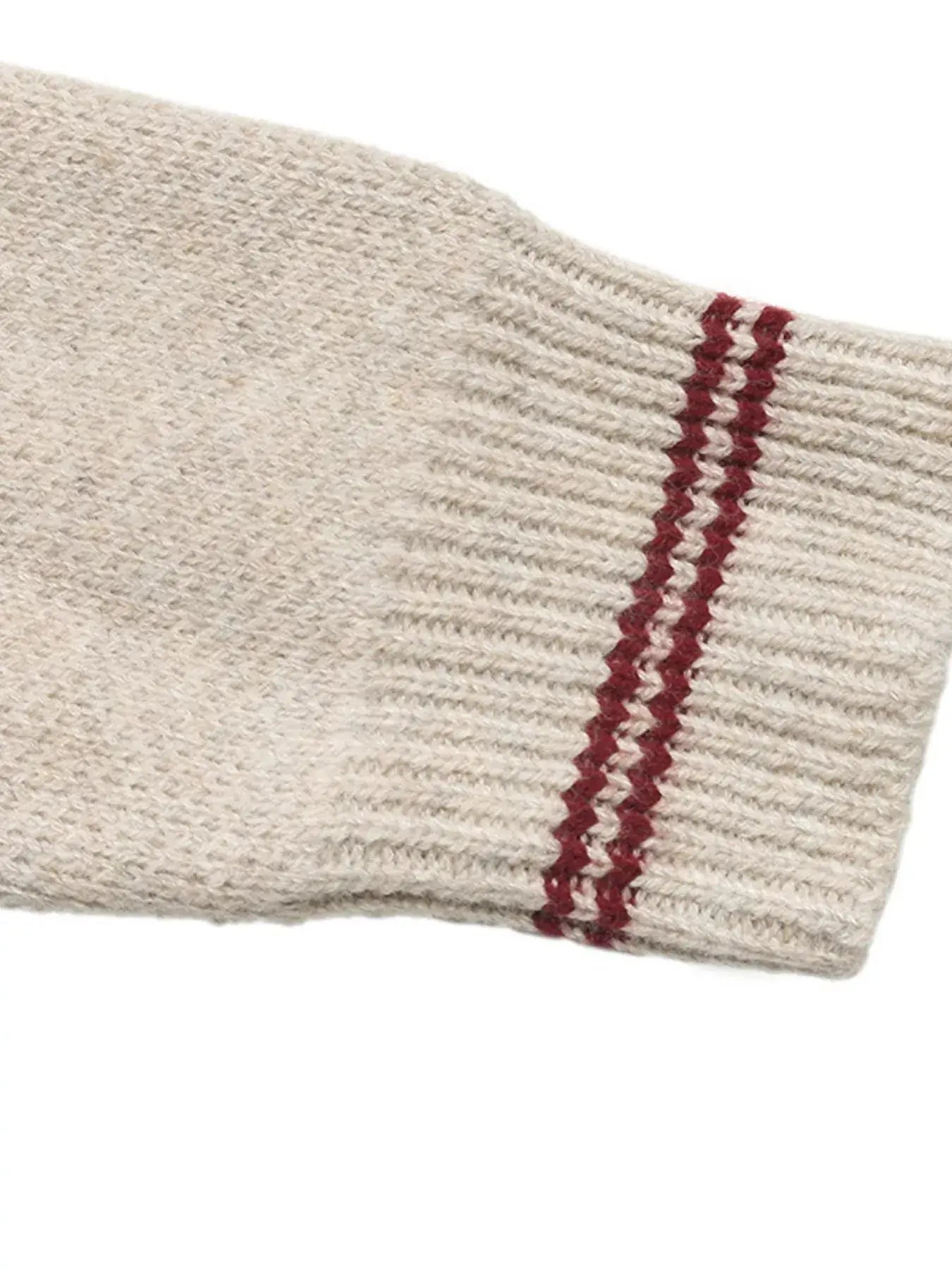 Detail of the sleeve of the Zip Up Contrast Trim Cardigan with red contrast stripes.