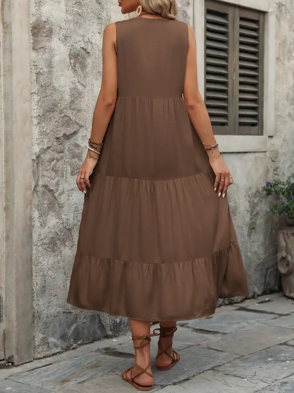 Ivy Lane Decorative Button Notched Sleeveless Dress in brown, showcasing the back view with tiered skirt design.