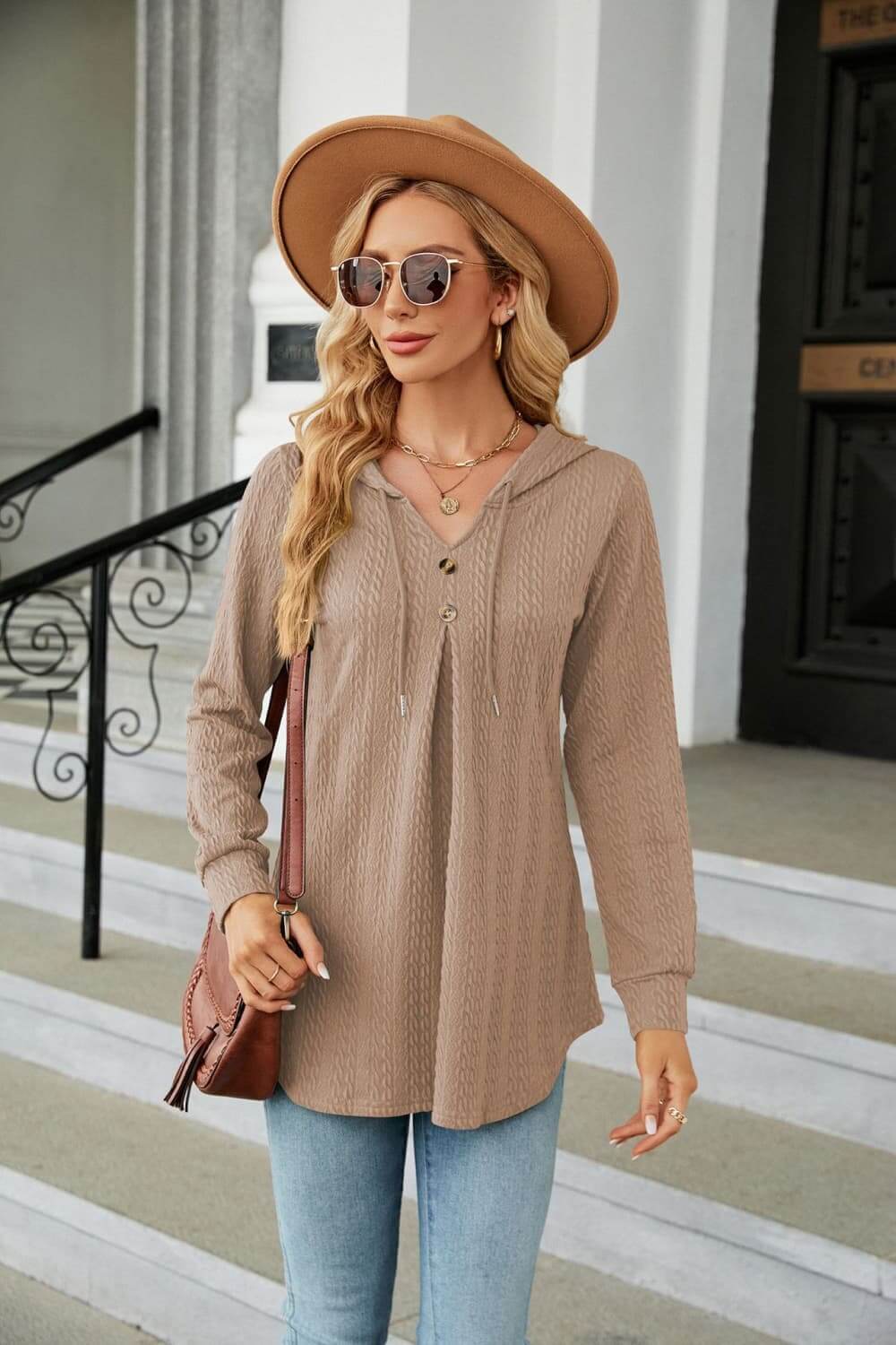 Long Sleeve Hooded Blouse in a cozy beige shade with button accents, styled with jeans and a hat.