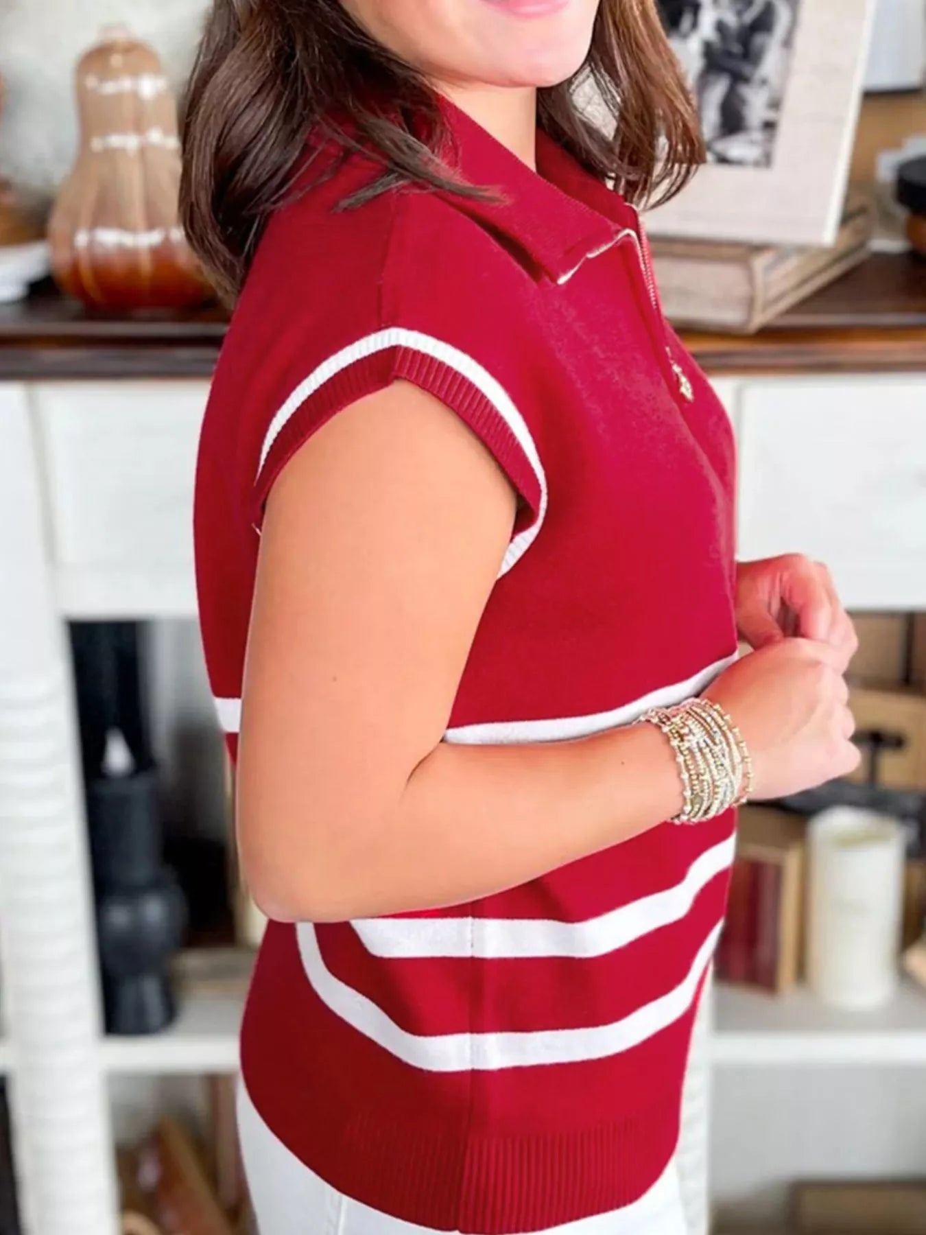 Striped Zip-Up Collar Sweater Vest in red worn by a woman, showcasing a modern layered look with stylish stripes.