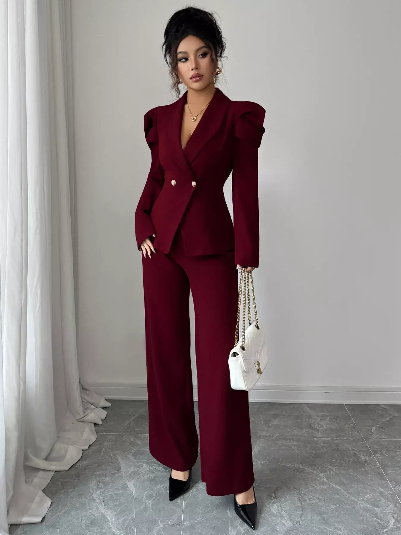 Model showcasing the Double-Breasted Blazer and Pants Suit Set in burgundy, exuding modern elegance.