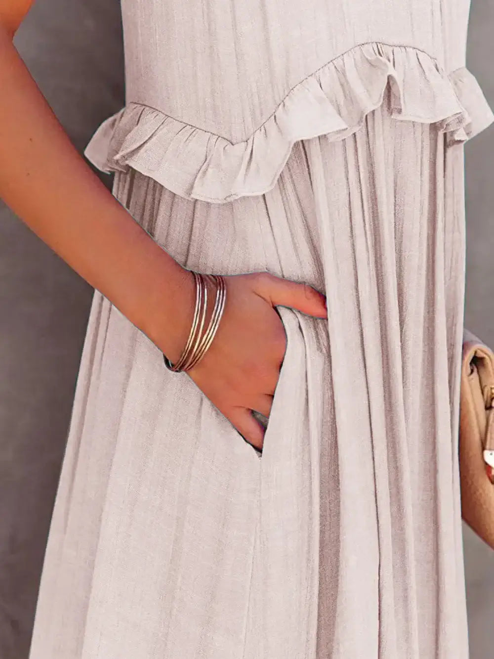 Ruffled Sleeveless Tiered Maxi Dress with Pockets showcasing soft ruffles and hidden pockets, perfect for casual outings.