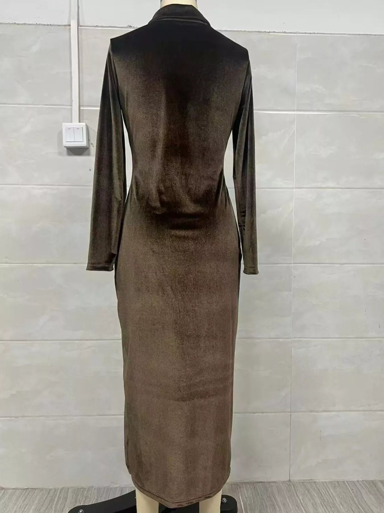 Back view of a Velvet Zip Front Slit Midi Dress in a rich brown color showcasing the sleek bodycon style.