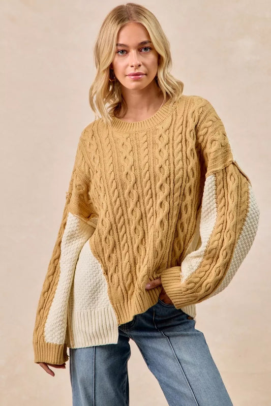 BiBi Cable Knit Hacci Combo Sweater design featuring a cozy blend of cable knit and uneven hem in a stylish tan color.
