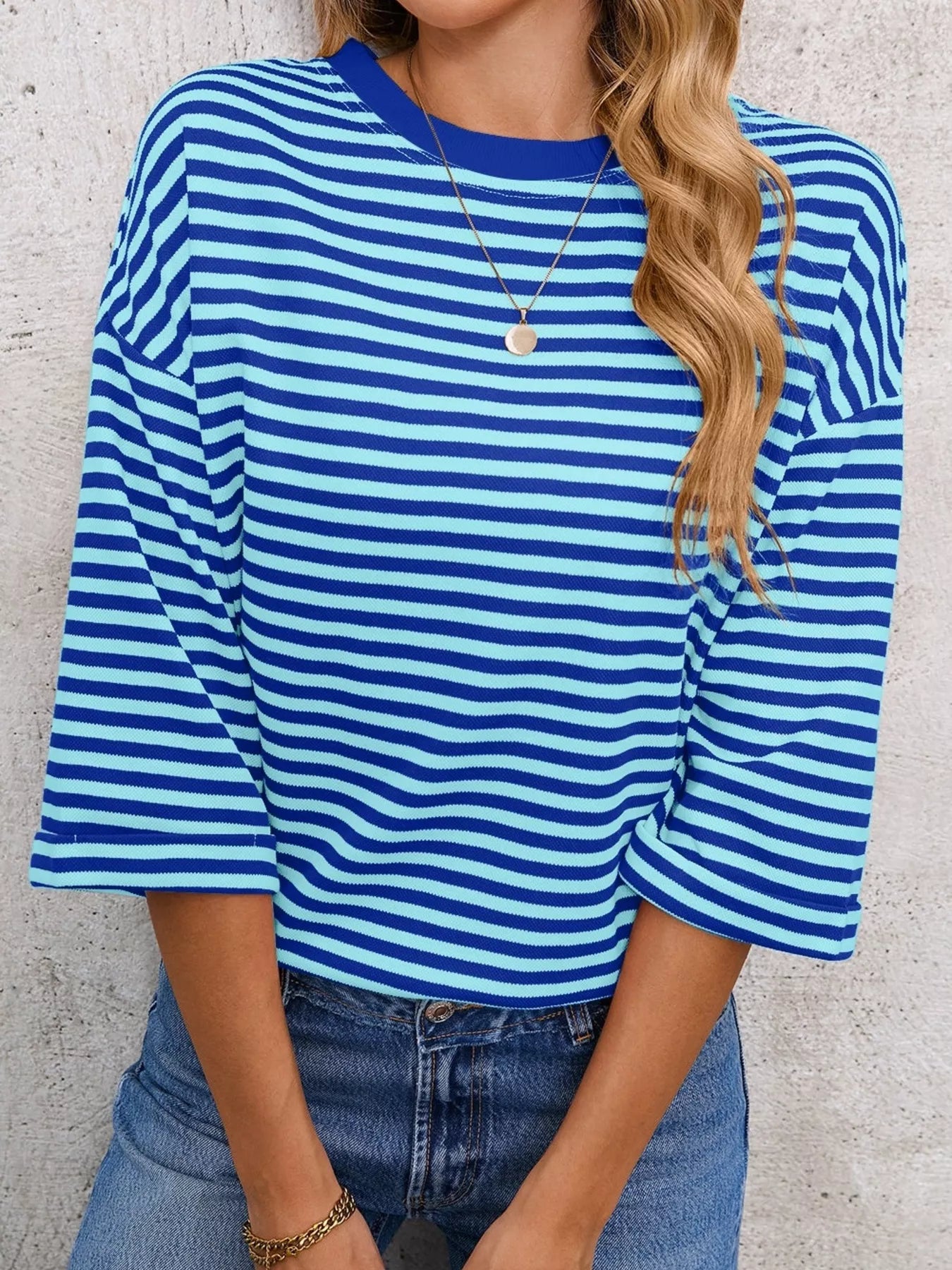 Striped Back Bow Tie T-Shirt in blue and white stripes, featuring an oversized fit and casual everyday style.
