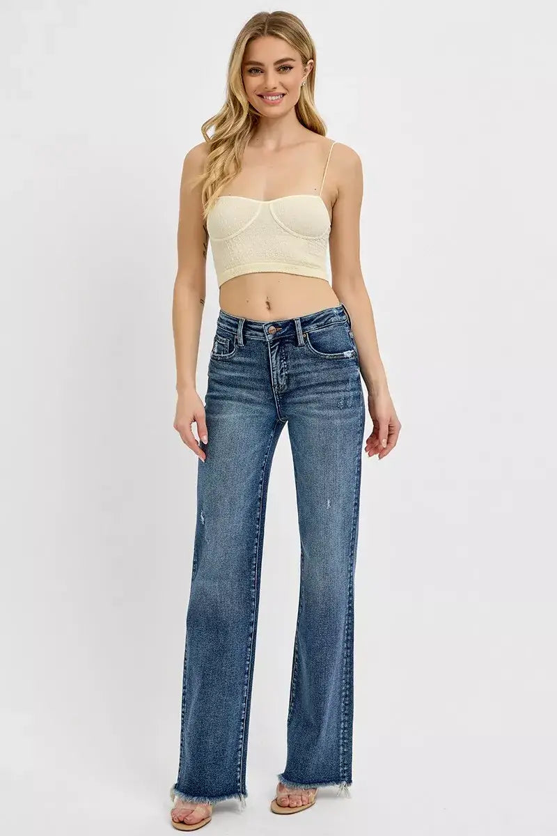 Model wearing RISEN High Rise Straight Plus Size Jeans with tummy control fit, showcasing a stylish and comfortable look.