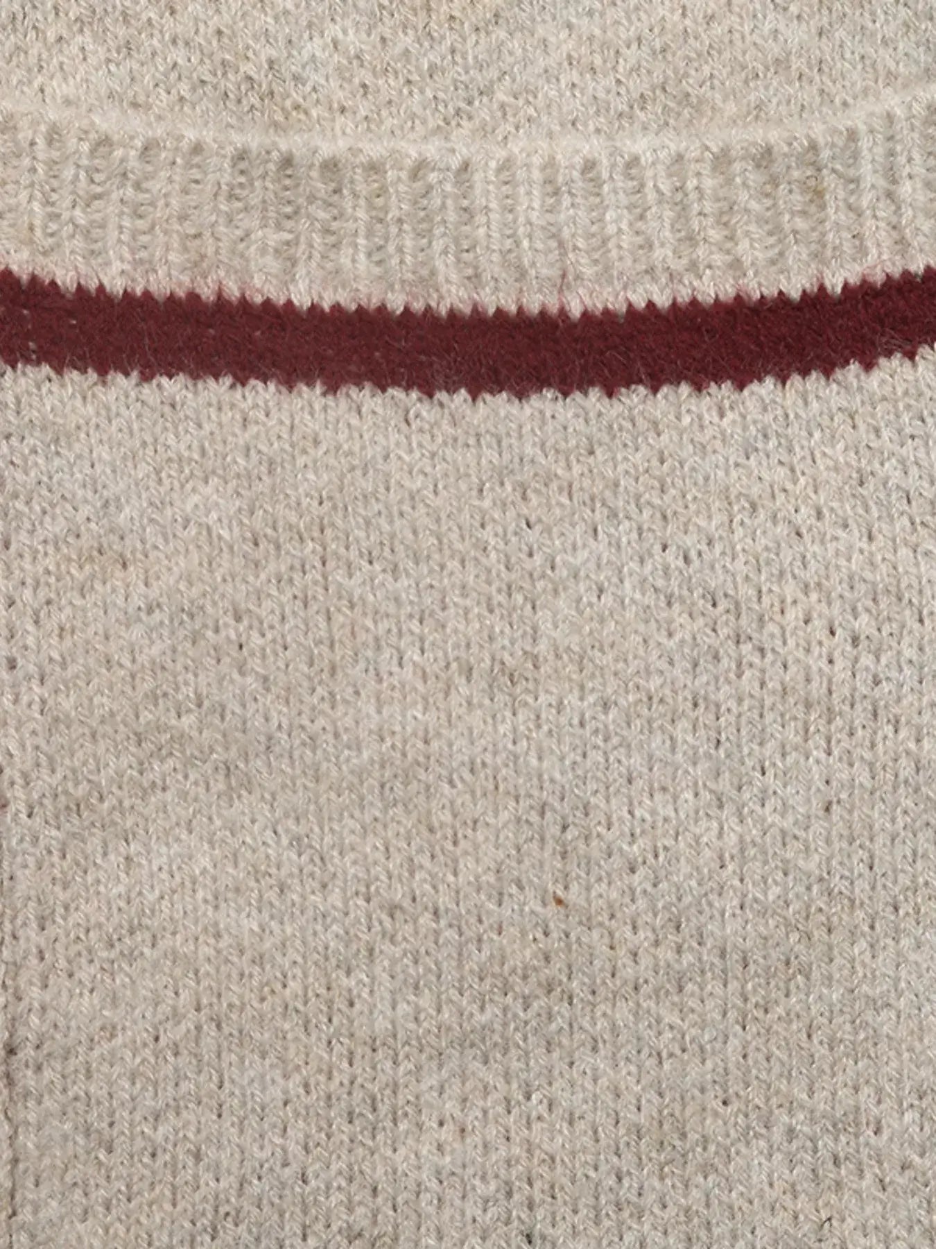 Close-up of the fabric texture of the Zip Up Contrast Trim Cardigan with button detail, showing beige with maroon trim.