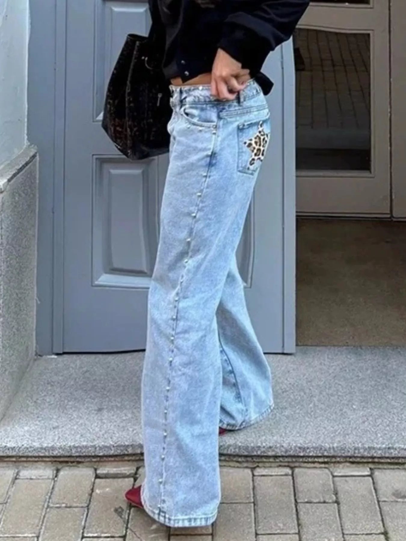 Leopard Star Patches Wide Leg Jeans displayed on model, featuring leopard star patches and a relaxed fit.