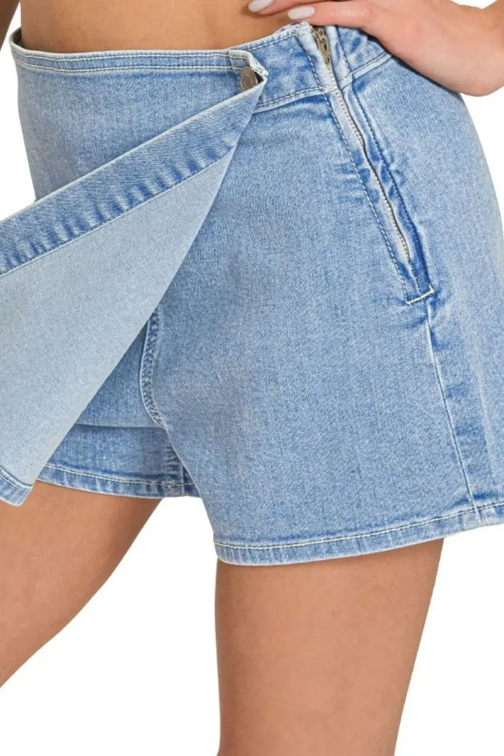 Zenana wrap front skort denim shorts, combining skirt style with shorts comfort, featuring a buttoned design and slight stretch.