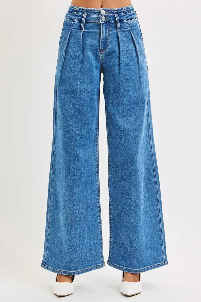RISEN Plus Size Pleated Wide Leg Jeans in mid rise blue denim, showcasing elegant pleats and a flattering silhouette.