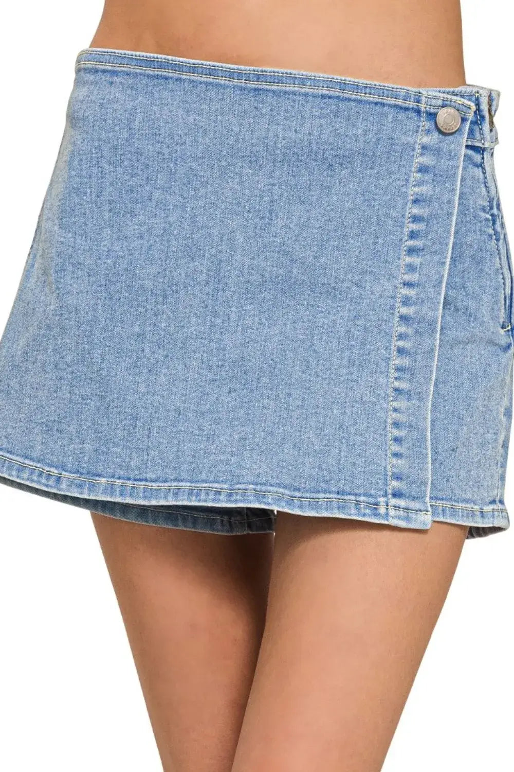 Zenana wrap front skort denim shorts in light blue, combining stylish skirt and comfortable short features.
