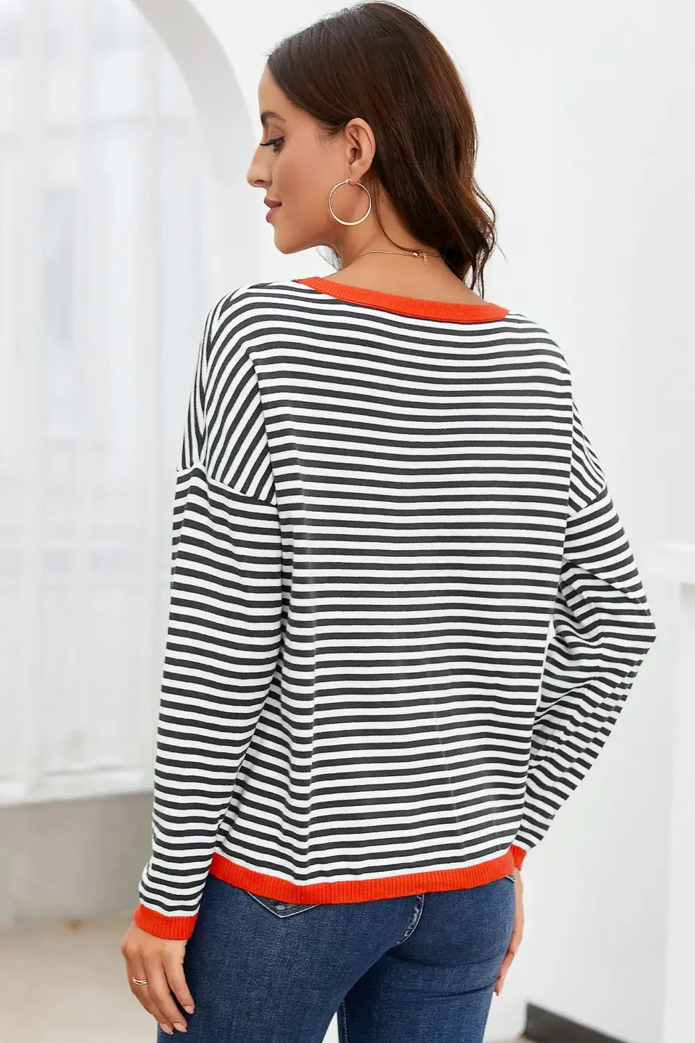 Striped Round Neck Drop Shoulder T-Shirt back view in black and white stripes with orange trim, casual and stylish.