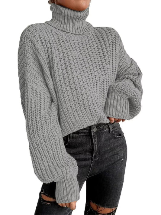 Chunky Knit Turtleneck Long Sleeve Sweater Cozy Fit in light gray with oversized sleeves and ribbed texture.