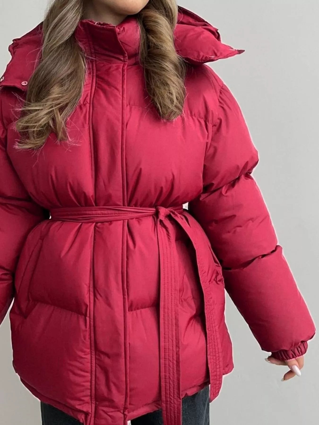 Mid Length Hooded Winter Coat Belted in vibrant red with a belted waist and hood, featuring thick insulation and a cozy fit.