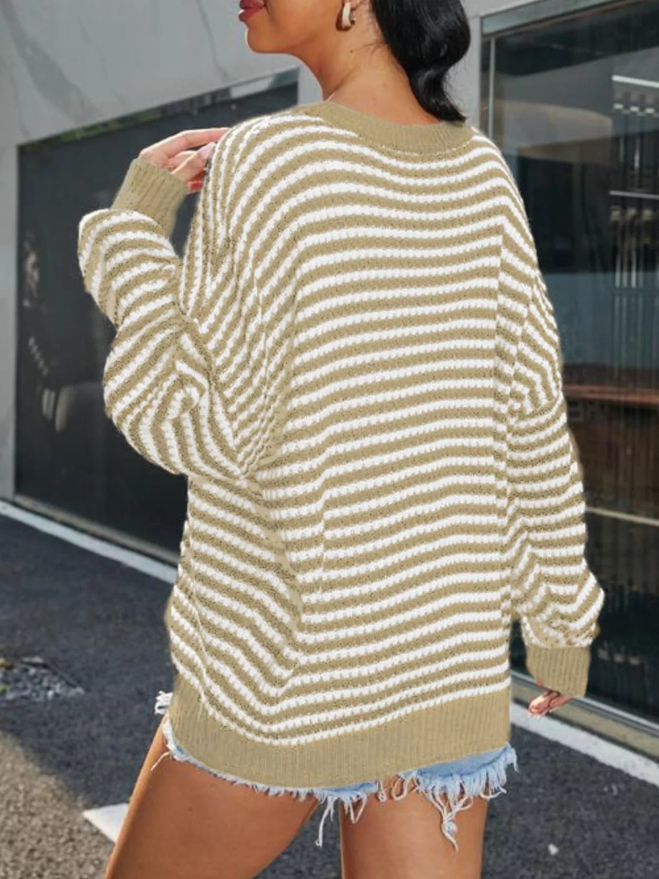 Striped Round Neck Drop Shoulder Sweater – Casual Cozy Knit in beige and white from the back, with distressed denim shorts.