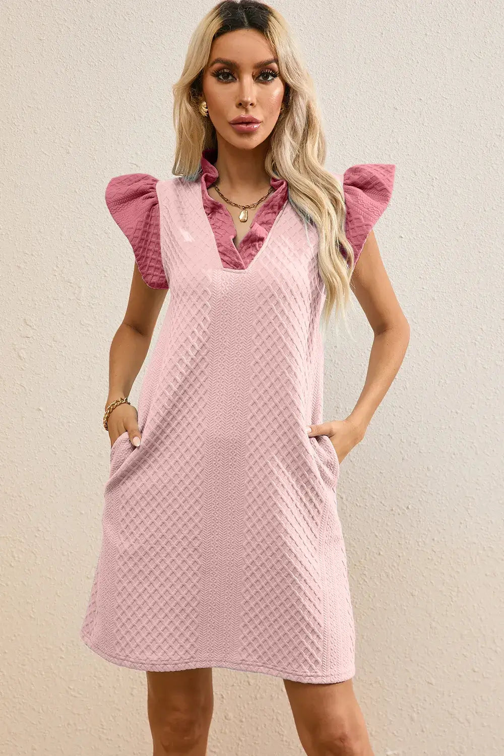 Ruffled V-Neck Cap Sleeve Mini Dress in pink with pockets and textured fabric for a chic everyday style.