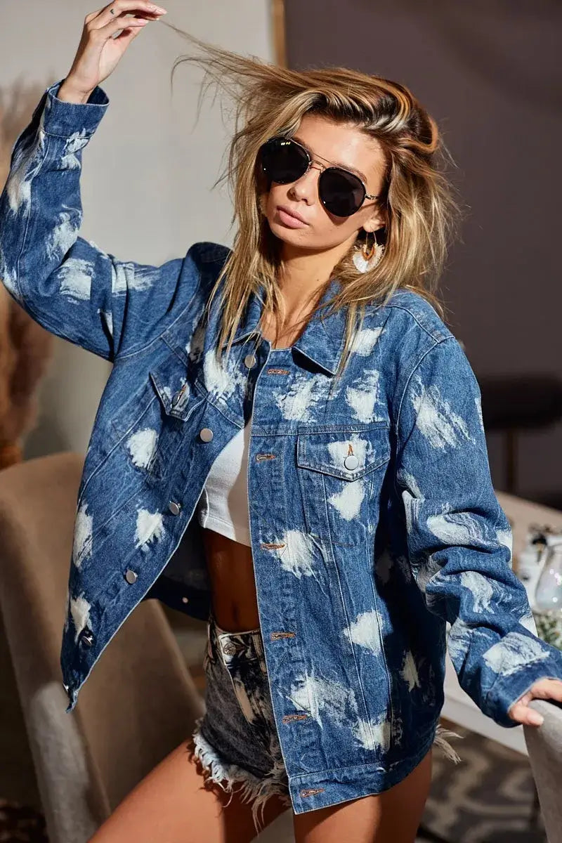 Woman wearing BiBi Washed Tie Dye Denim Jacket with shorts and sunglasses, showcasing a trendy and oversize look.
