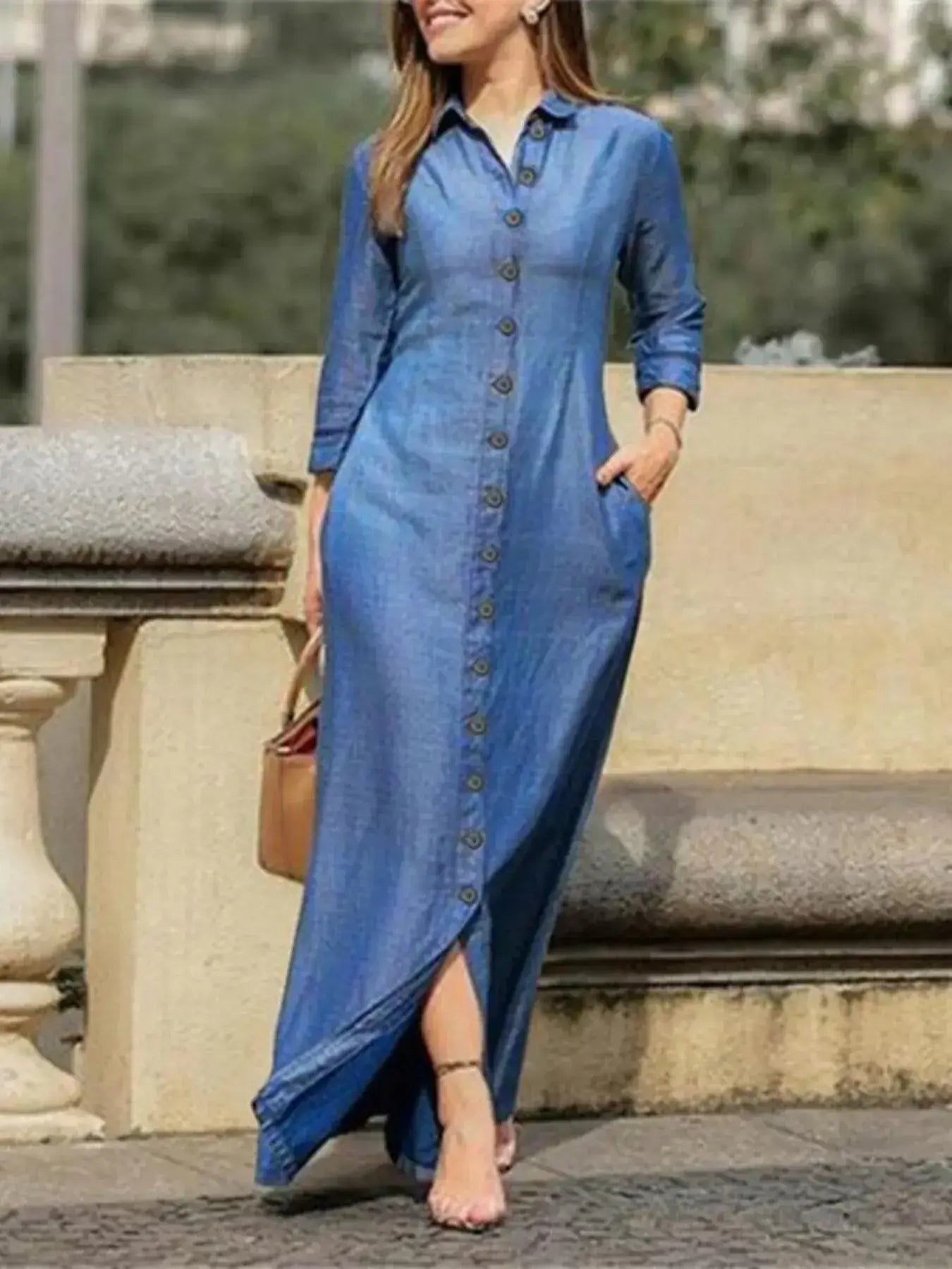 Model wearing a Full Size Button-Down Maxi Denim Dress with pockets and a flattering slit.