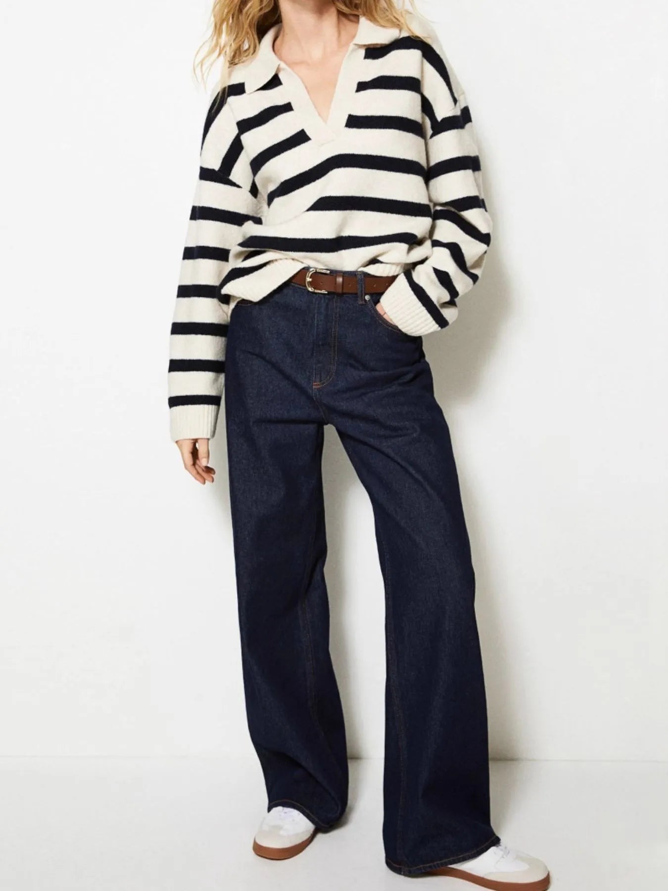 Striped Johnny Collar Long Sleeve Sweater worn with high-waisted denim pants and casual shoes, showcasing a modern knit style.