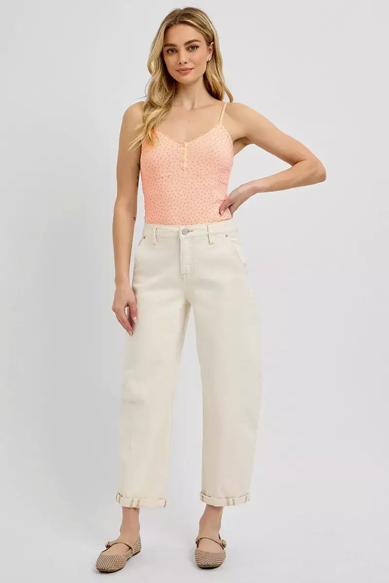 Model in RISEN High Rise Relaxed Barrel Cuffed Jeans, showcasing a trendy and comfortable look with a peach top.
