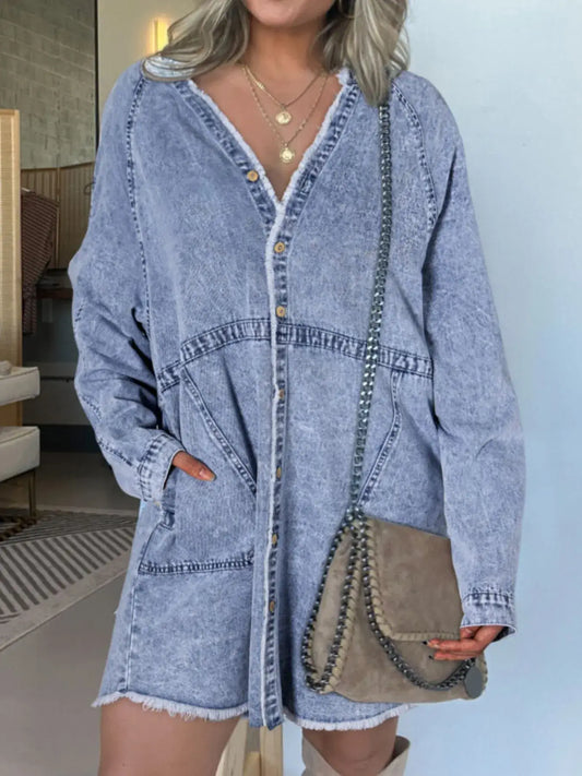 Model wearing a full size button-front long sleeve denim shirt dress with pockets and a stylish bag.