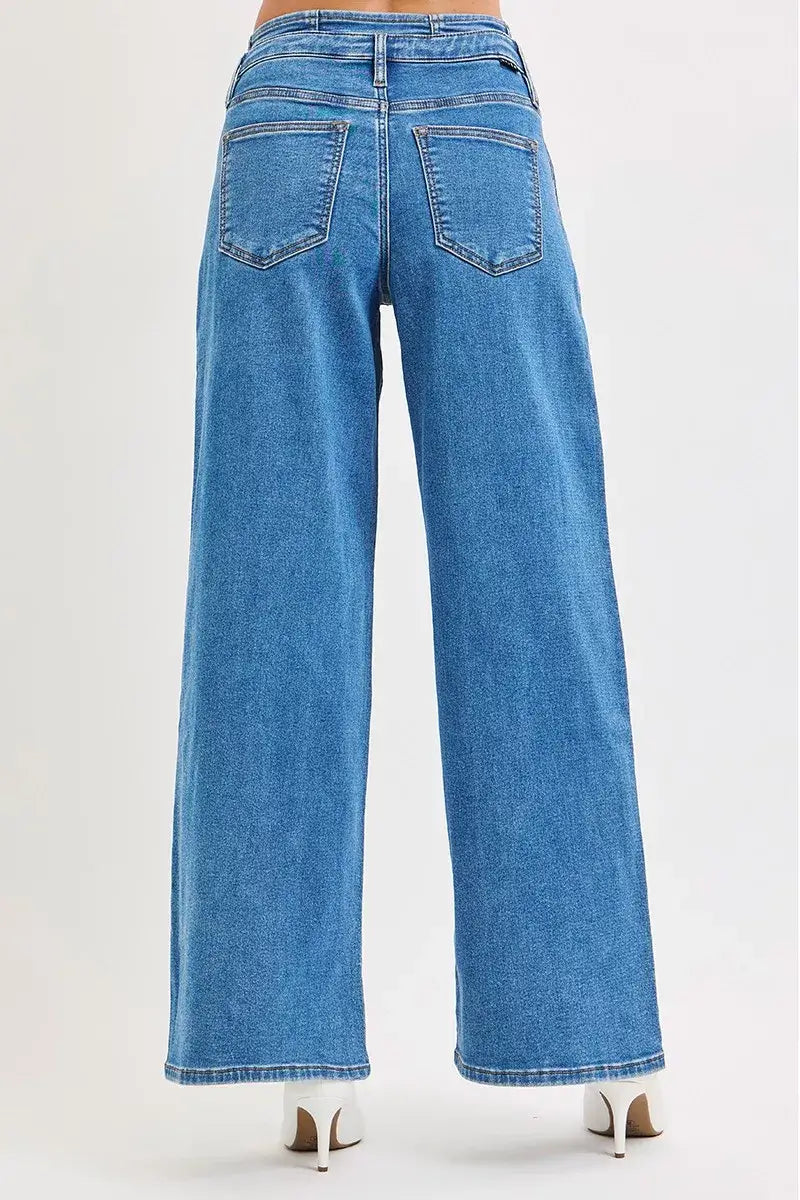 Back view of RISEN Pleated Wide Leg Plus Size Jeans showcasing mid-rise fit and pleated wide legs.
