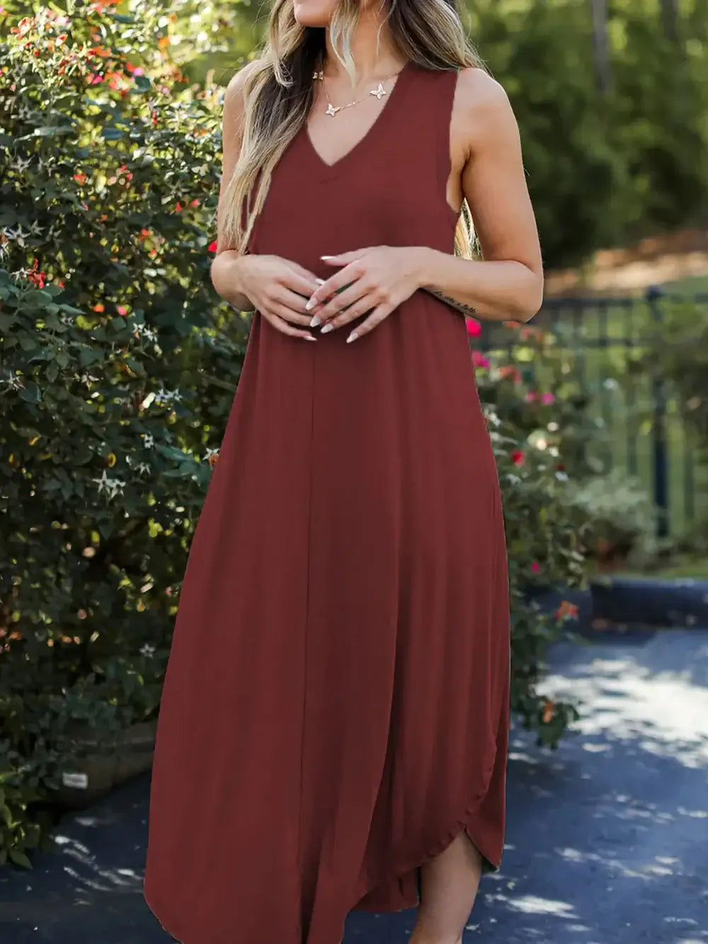 Model wearing Full Size V-Neck Midi Tank Dress in brown, showcasing its casual and chic style outdoors.