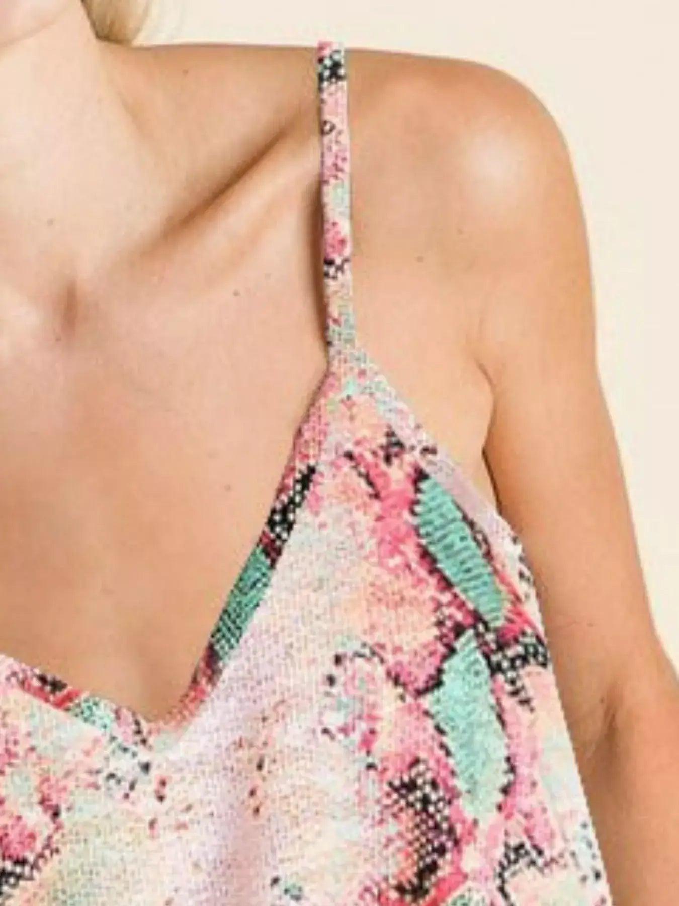 BiBi Snakeskin Low Gauge Sleeveless Top featuring vibrant colors and a stylish design.