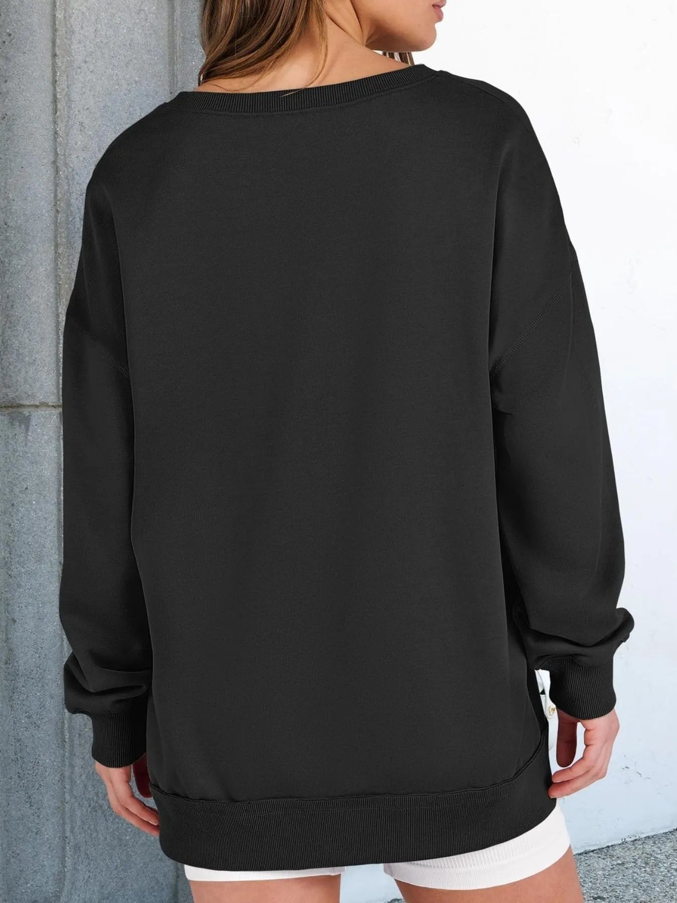 Notched Long Sleeve Oversized Sweatshirt back view, showcasing its black color and relaxed fit for casual wear.