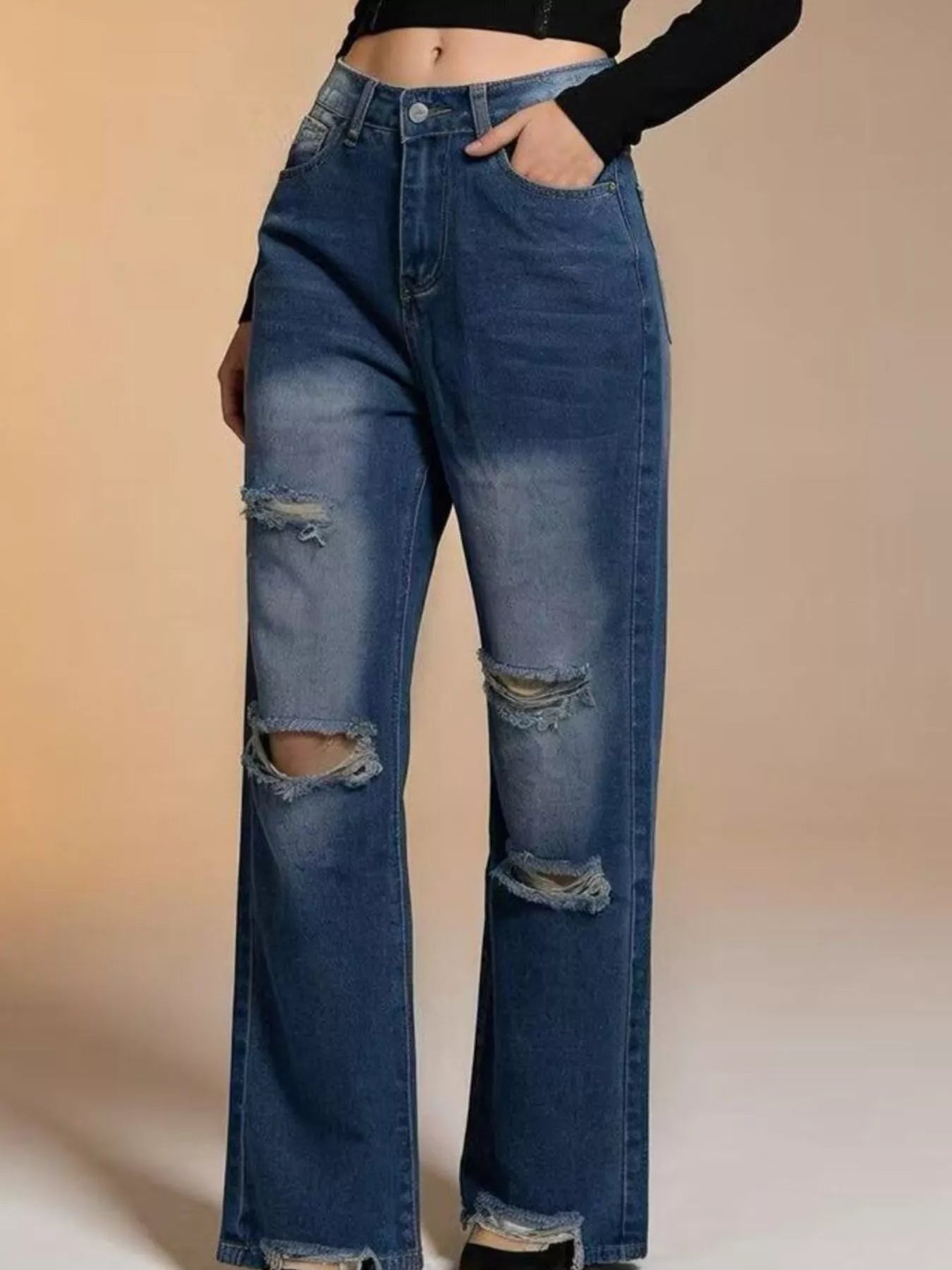 Distressed Wide Leg Jeans with buttoned pocketed design featured in an eye-catching blue wash.