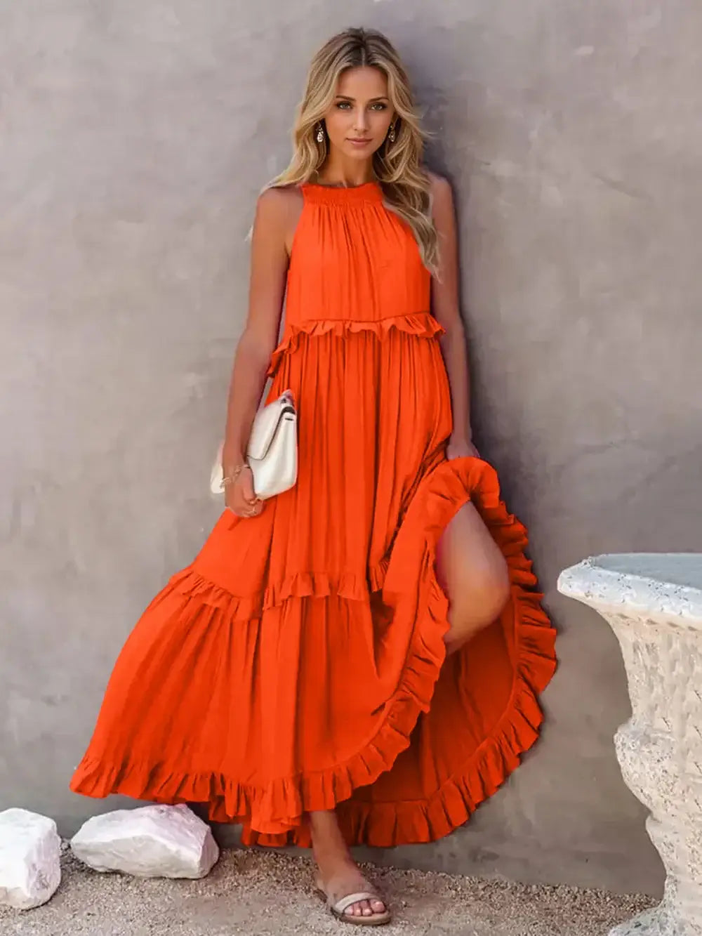 Ruffled Sleeveless Tiered Maxi Dress with Pockets in vibrant orange, featuring ruffles and tiered silhouette.