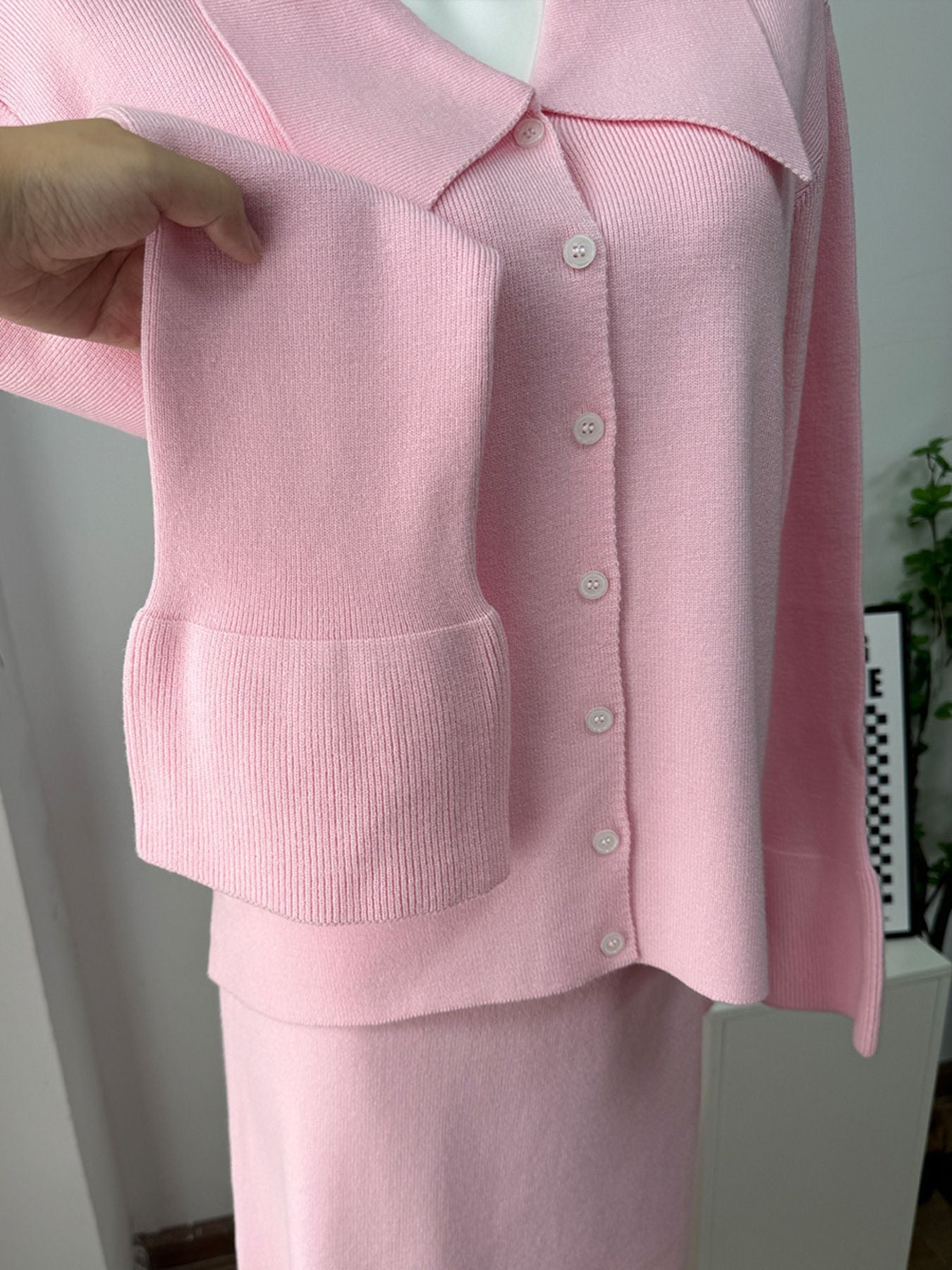 Button Down Cardigan and Skirt Knit Set featuring a pink ribbed cardigan and matching skirt for a stylish two-piece outfit.