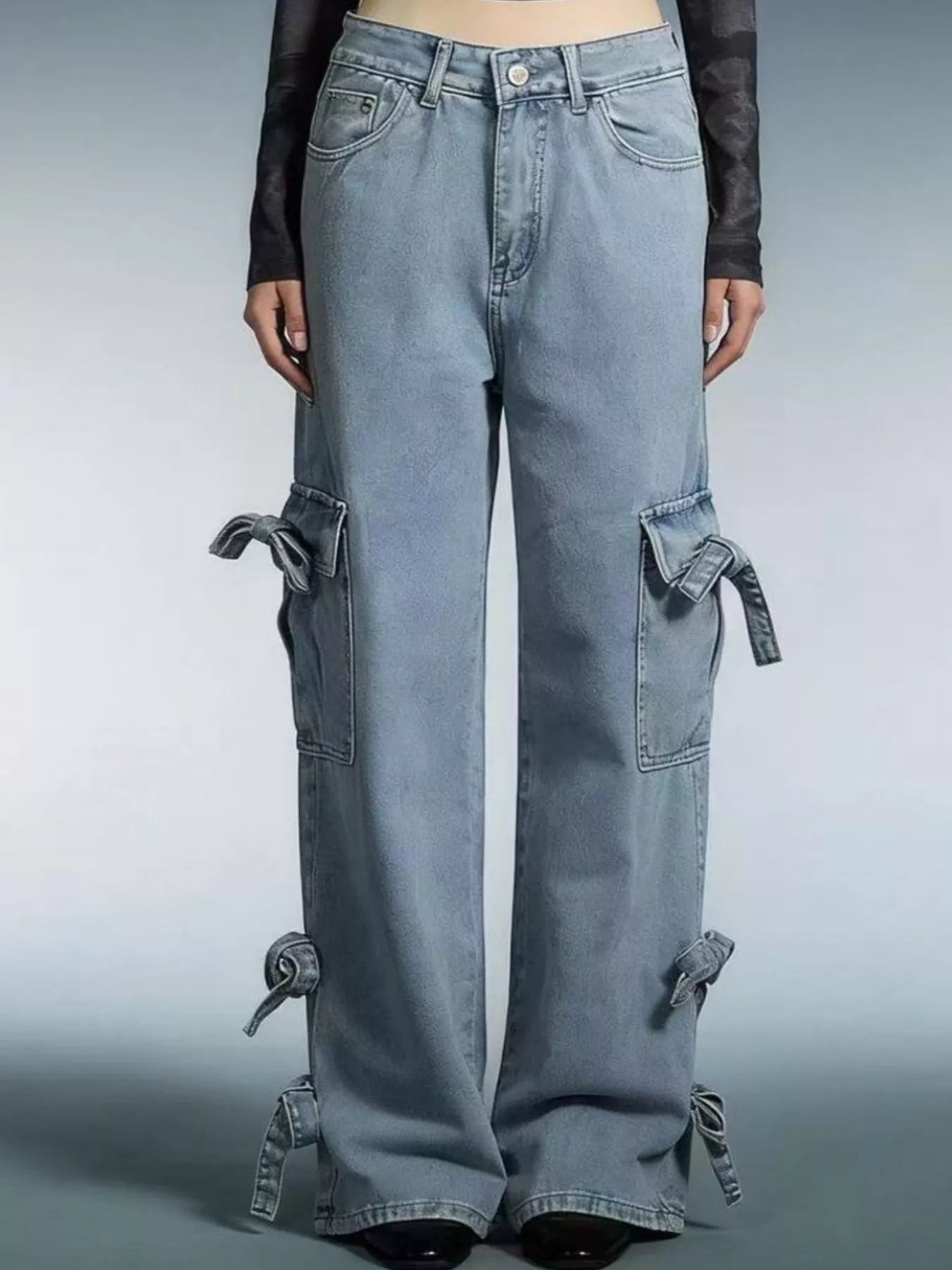 Bow Wide Leg Jeans with pocketed detail and relaxed fit, featuring stylish bow accents on the sides.