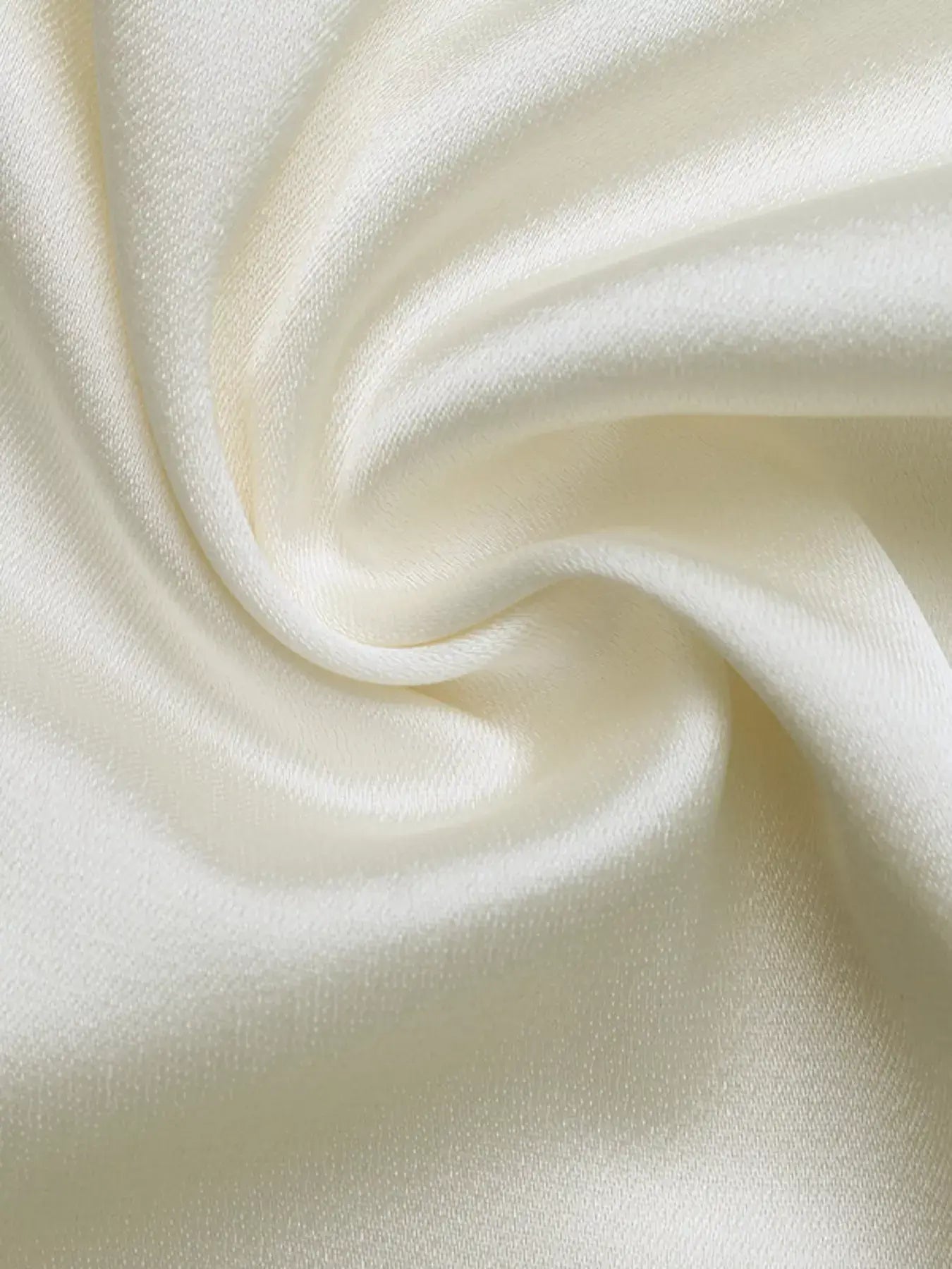 Close-up of lightweight 100% polyester fabric for Contrast Trim V-Neck Blouse in soft cream color.