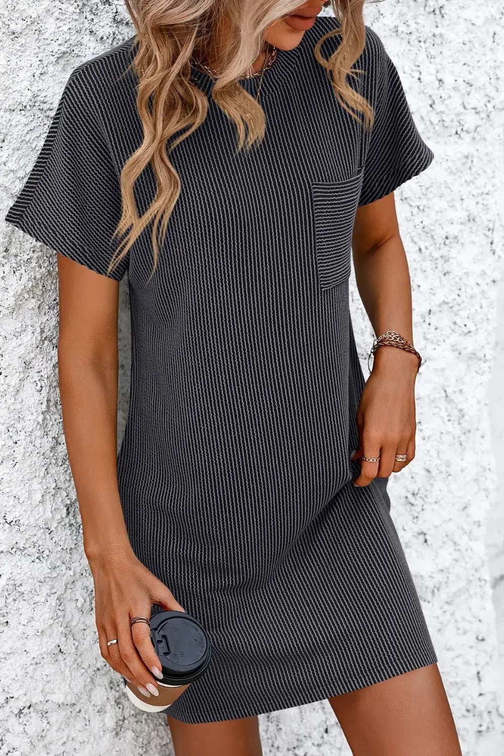 Mandy Ribbed Striped Mini Tee Dress in black, featuring short sleeves and a pocket, ideal for casual wear.