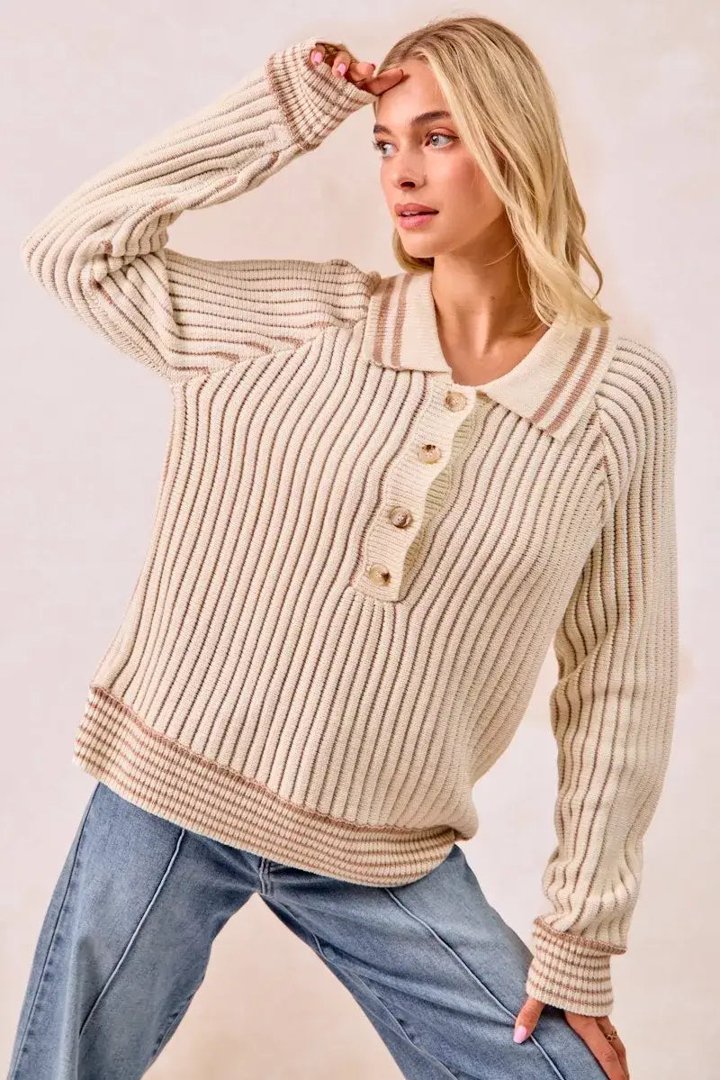 Model wearing the BiBi half button ribbed two tone sweater styled with casual jeans, showcasing its comfy design.
