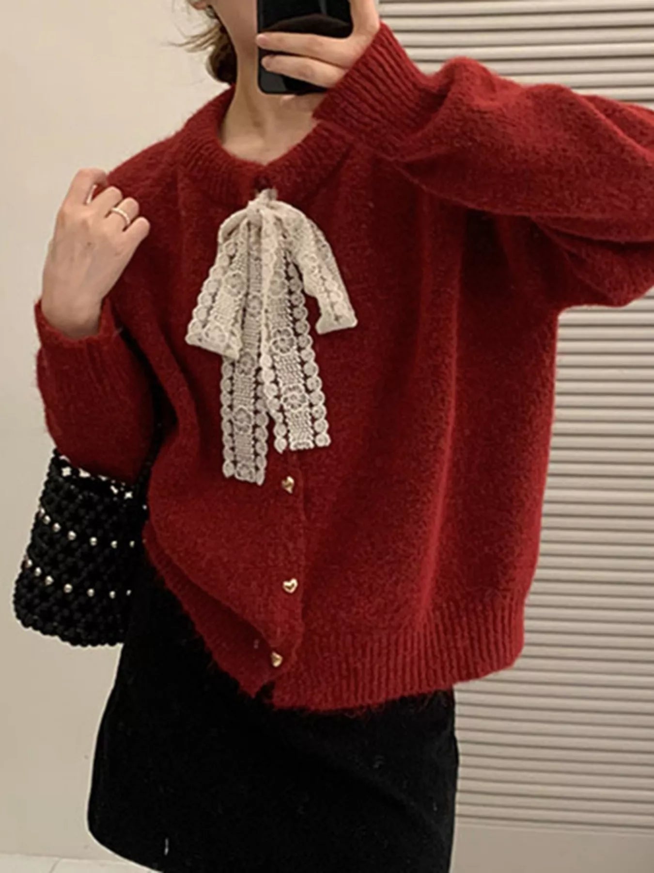 Lace Bowknot Knit Cardigan in red, featuring a lace bowtie and buttoned front, perfect for feminine everyday style.